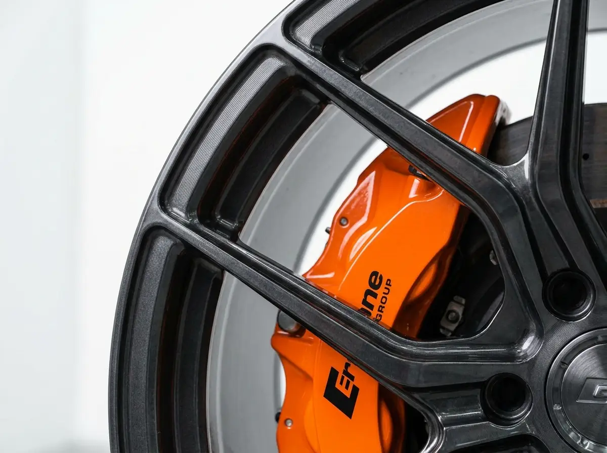 Forged gunmetal wheel with orange brake caliper